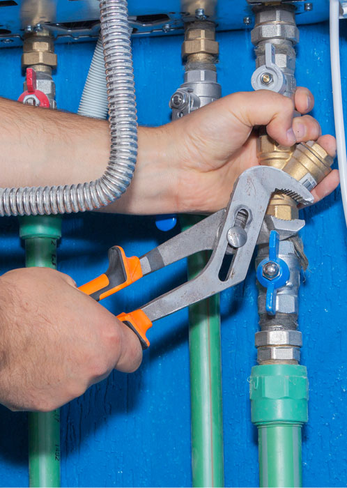 A Gas Doctor technician working on gas lines